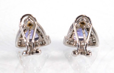 Lot 563 - A pair of 14ct white gold ear studs, each set...