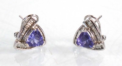 Lot 563 - A pair of 14ct white gold ear studs, each set...