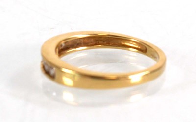 Lot 566 - An 18ct yellow gold half eternity ring set...