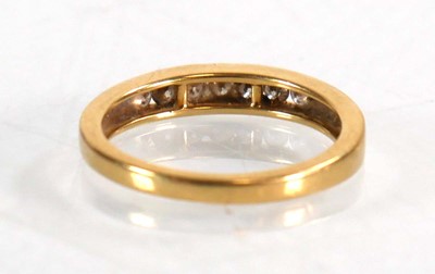 Lot 566 - An 18ct yellow gold half eternity ring set...