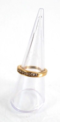 Lot 566 - An 18ct yellow gold half eternity ring set...