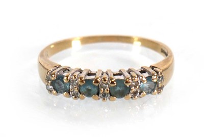 Lot 567 - A 9ct yellow gold half eternity ring set four...