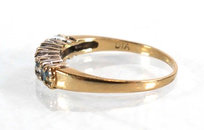 Lot 567 - A 9ct yellow gold half eternity ring set four...