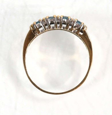Lot 567 - A 9ct yellow gold half eternity ring set four...