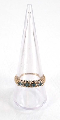 Lot 567 - A 9ct yellow gold half eternity ring set four...