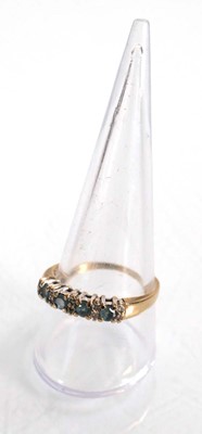 Lot 567 - A 9ct yellow gold half eternity ring set four...