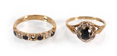 Lot 573 - A 9ct yellow gold sapphire and diamond cluster...