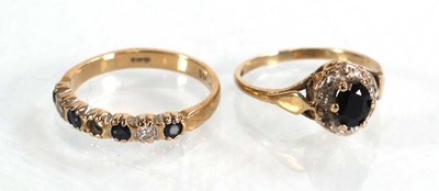 Lot 573 - A 9ct yellow gold sapphire and diamond cluster...