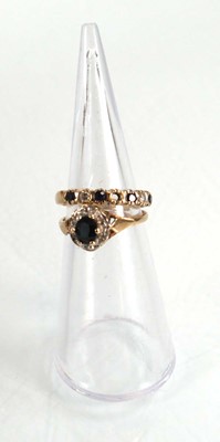 Lot 573 - A 9ct yellow gold sapphire and diamond cluster...