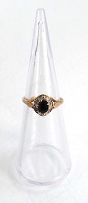 Lot 573 - A 9ct yellow gold sapphire and diamond cluster...