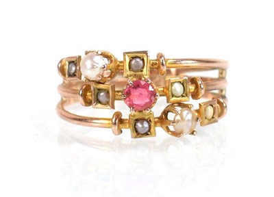 Lot 575 - A 9ct yellow gold triple shank ring set pink...