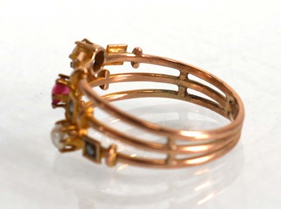 Lot 575 - A 9ct yellow gold triple shank ring set pink...
