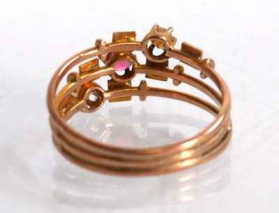 Lot 575 - A 9ct yellow gold triple shank ring set pink...