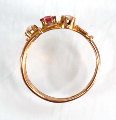 Lot 575 - A 9ct yellow gold triple shank ring set pink...