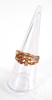 Lot 575 - A 9ct yellow gold triple shank ring set pink...