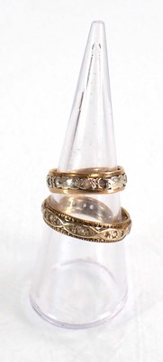 Lot 579 - Two 9ct yellow and white gold eternity rings,...