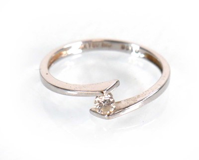Lot 581 - An 18ct white gold cross ring set small...
