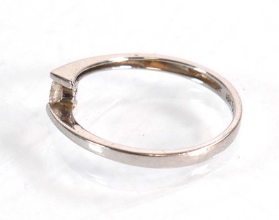 Lot 581 - An 18ct white gold cross ring set small...