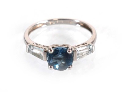 Lot 582 - A 9ct white gold ring set three graduated pale...