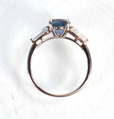 Lot 582 - A 9ct white gold ring set three graduated pale...