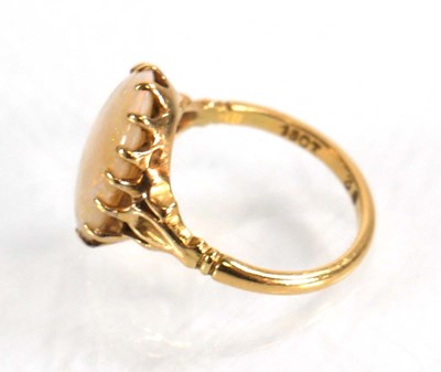 Lot 583 - An 18ct yellow gold set set oval opal within a...