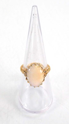 Lot 583 - An 18ct yellow gold set set oval opal within a...