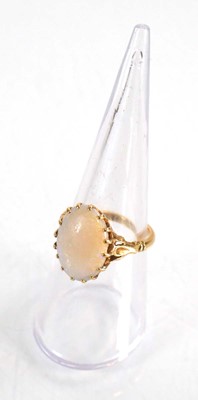 Lot 583 - An 18ct yellow gold set set oval opal within a...