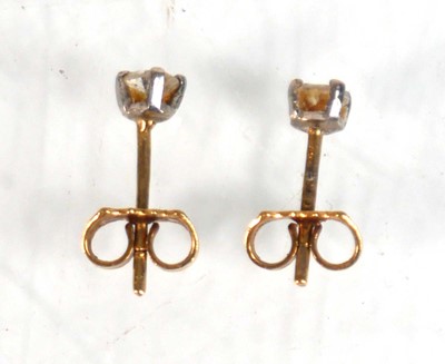 Lot 585 - A pair of 18ct yellow gold ear studs, each set...