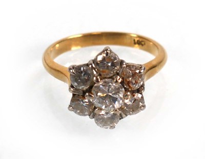 Lot 586 - An 18ct yellow gold cluster ring set seven...