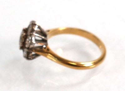 Lot 586 - An 18ct yellow gold cluster ring set seven...