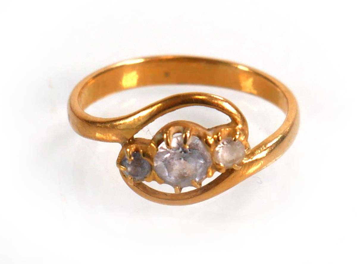 Lot 588 - A yellow metal crossover ring set three...