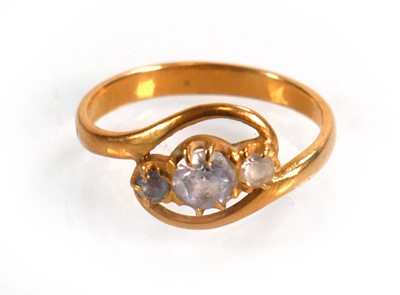 Lot 588 - A yellow metal crossover ring set three...