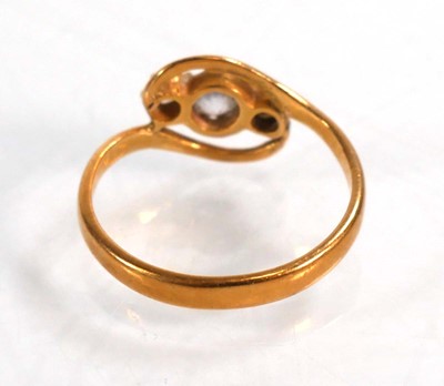 Lot 588 - A yellow metal crossover ring set three...
