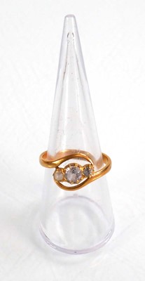 Lot 588 - A yellow metal crossover ring set three...