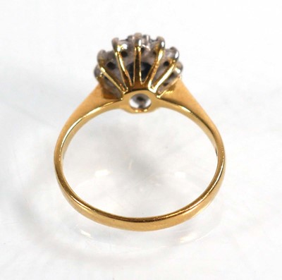 Lot 590 - An 18ct yellow gold cluster ring set oval...