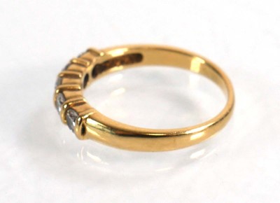 Lot 591 - An 18ct yellow gold half eternity ring set...