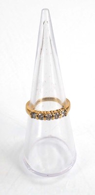 Lot 591 - An 18ct yellow gold half eternity ring set...