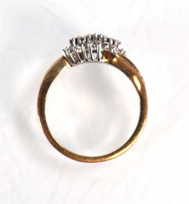 Lot 594 - A 9ct yellow gold crossover ring set three...