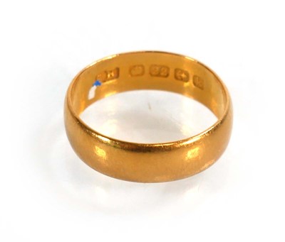 Lot 599 - A 22ct yellow gold wedding band, Birmingham...