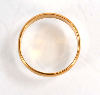 Lot 599 - A 22ct yellow gold wedding band, Birmingham...