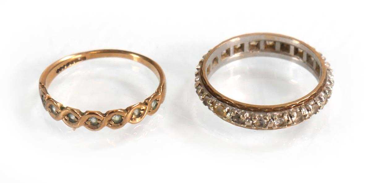 Lot 602 - A 9ct yellow gold half eternity ring set paste,...