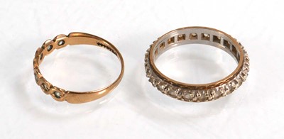 Lot 602 - A 9ct yellow gold half eternity ring set paste,...