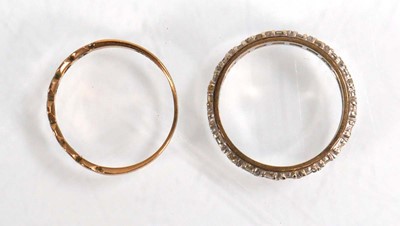 Lot 602 - A 9ct yellow gold half eternity ring set paste,...