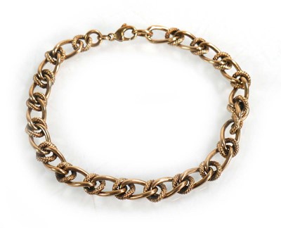 Lot 603 - A 9ct yellow gold engraved and plain curblink...