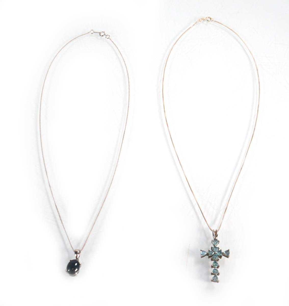 Lot 607 - A silver fine curblink necklace suspending a...