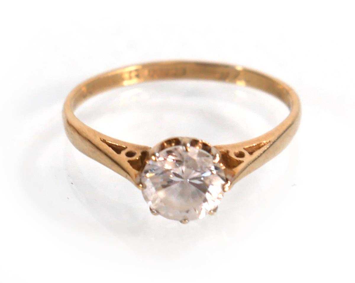 Lot 608 - A 9ct yellow gold ring set cubic zirconia,...