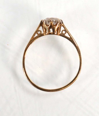 Lot 608 - A 9ct yellow gold ring set cubic zirconia,...