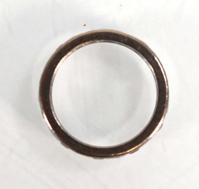 Lot 610 - A white metal eternity ring set small...