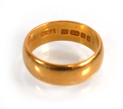 Lot 613 - A 22ct yellow gold wedding band, London 1966,...