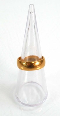 Lot 613 - A 22ct yellow gold wedding band, London 1966,...